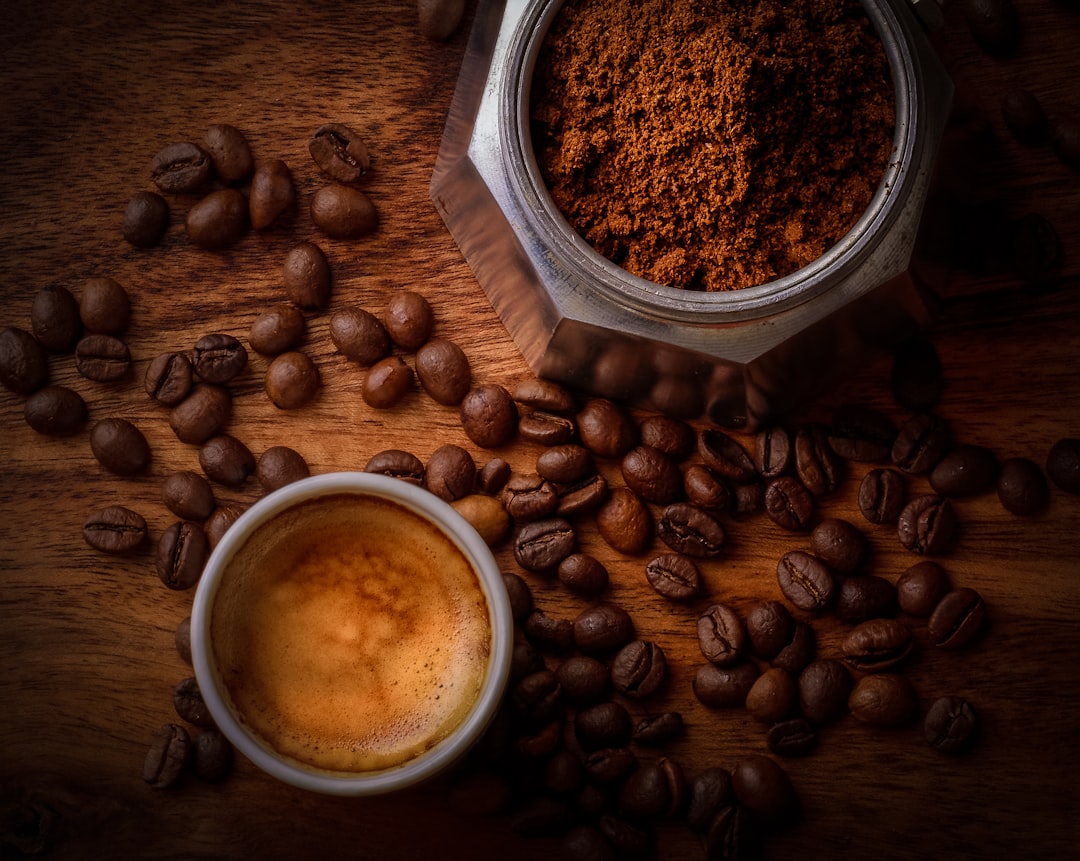 services-08 brown-coffee-beans-beside-white-ceramic-mug-h9iq22jjlgk